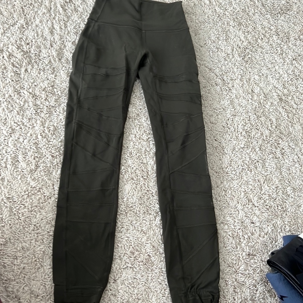 Army green leggings with fun mesh detail on front of legs